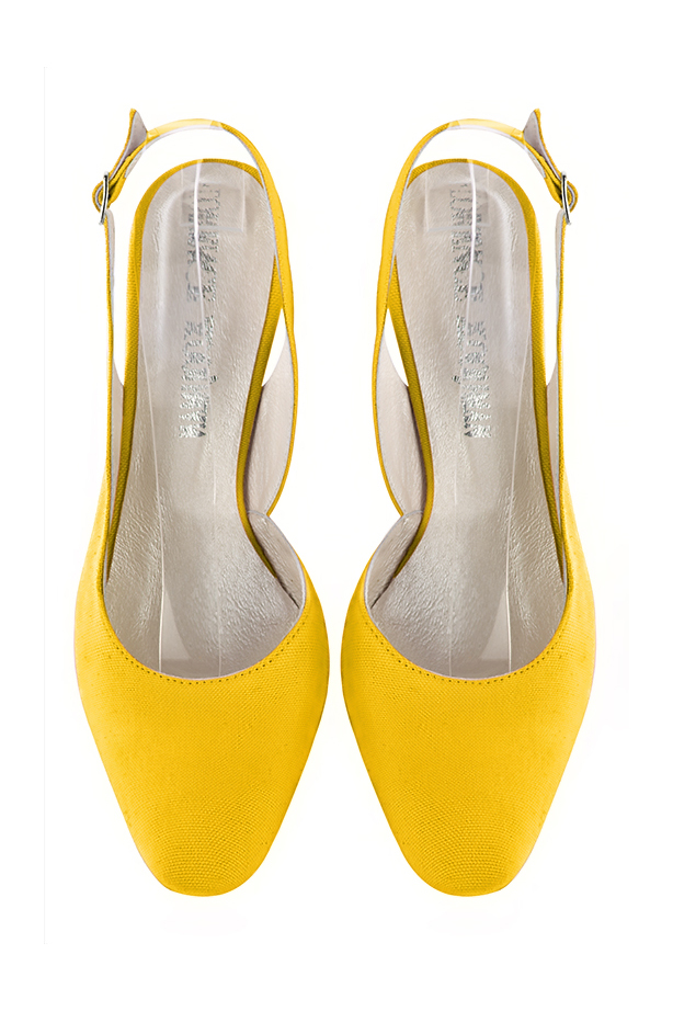 Women's yellow slingback dress shoes. Round toe. High kitten heels - Top view